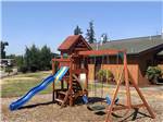 The wooden playground equipment at SILVER SPUR RV PARK & RESORT - thumbnail