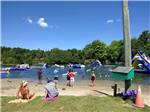 People sitting on the beach at EMERALD LAKE TRAILER RESORT & WATERPARK - thumbnail