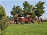 The wooden playground equipment at FORT AMARILLO RV RESORT - thumbnail