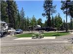 A picnic table next to an RV site at MCCALL RV RESORT - thumbnail