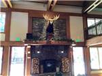 A moose head hanging over the fireplace at MCCALL RV RESORT - thumbnail