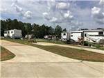 A view of trailers in paved sites at RV HIDEAWAY CAMPGROUND - thumbnail