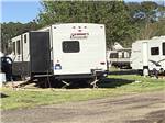 A travel trailer in a gravel RV site at MEMPHIS-SOUTH RV PARK & CAMPGROUND - thumbnail
