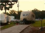 A travel trailer in a back in RV site at BIRDSONG RESORT & MARINA LAKESIDE RV & TENT CAMPGROUND - thumbnail