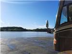 A motorhome by the river at BIRDSONG RESORT & MARINA LAKESIDE RV & TENT CAMPGROUND - thumbnail
