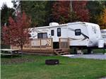 Site with built on deck at TWIN GROVE RV RESORT & COTTAGES - thumbnail