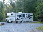RV parked at campsite at TWIN GROVE RV RESORT & COTTAGES - thumbnail