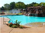 Swimming pool and rock water fall at MILL CREEK RANCH RESORT - thumbnail