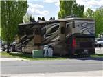 A motorhome in a paved RV site at HORN RAPIDS RV RESORT - thumbnail