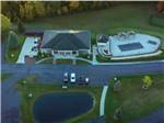 Aerial view of main building with pool and pond at TRAVERSE BAY RV RESORT - thumbnail