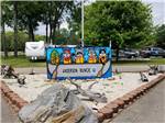 A sign with animal face cut outs at MUNCIE RV RESORT BY RJOURNEY - thumbnail