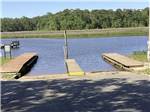 A row of empty docks at INDIAN POINT RV RESORT - thumbnail