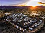 An aerial view of the campground at dusk at DISTANT DRUMS RV RESORT - thumbnail