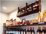 Shelf full of different type of wine at DISTANT DRUMS RV RESORT - thumbnail