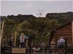A band singing on a deck at HERITAGE COVE RESORT - thumbnail