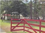 The red front entrance gate at SUN ROAMERS RV RESORT - thumbnail