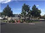 A motorhome in a campside surrounded by trees at SPARKS MARINA RV PARK - thumbnail