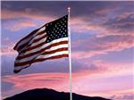 The American Flag at dusk at WHISKEY FLATS RV PARK - thumbnail