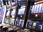 A line of slot machines at CENTURY CASINO & RV PARK - thumbnail