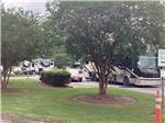 A motorhome in a paved RV site at CAPITAL CITY RV PARK - thumbnail