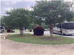 A motorhome with it's slides out at CAPITAL CITY RV PARK - thumbnail