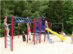 Playground with swing set at MEREDITH WOODS 4 SEASON CAMPING AREA - thumbnail