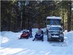 A pair of snowmobiles at MEREDITH WOODS 4 SEASON CAMPING AREA - thumbnail