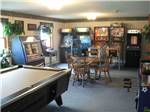 Lounge with pool table and classic arcade games at MEREDITH WOODS 4 SEASON CAMPING AREA - thumbnail