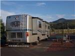 Class A motorhome parked in a gravel site at GRAND CANYON RAILWAY RV PARK - thumbnail