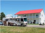 A motorhome at the registration building at MOUNTAIN HOME RV RESORT - thumbnail