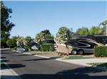 RVs parked in a row at THE LAKES RV & GOLF RESORT - thumbnail