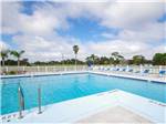 Swimming pool with outdoor seating at ENCORE CLERBROOK - thumbnail