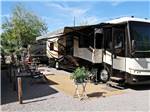 A motorhome in a gravel RV site at COLORADO RIVER OASIS RESORT - thumbnail