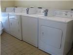 A row of washers and dryers at KIT FOX RV PARK - thumbnail