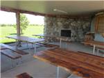 Patio area with picnic tables at FISHBERRY CAMPGROUND - thumbnail