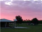The basketball court at dusk at FISHBERRY CAMPGROUND - thumbnail