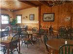 Tables and chairs in the restaurant at YELLOWSTONE VALLEY INN & RV PARK - thumbnail
