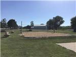 Sand Volleyball pit with benches for spectators at BEYONDER GETAWAY AT LAZY ACRES - thumbnail