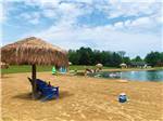 The sandy beach on the water at AMERICAN WILDERNESS CAMPGROUND - thumbnail