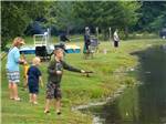 A group of people fishing at AMERICAN WILDERNESS CAMPGROUND - thumbnail