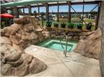 The hot tub next to the swimming pool at EVERGREEN PARK RV RESORT - thumbnail