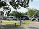 A line of gravel RV sites at FROG CITY RV PARK - thumbnail