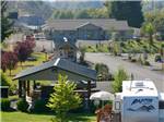 Aerial view of clubhouse with mountains in background at TOUTLE RIVER RV RESORT - thumbnail