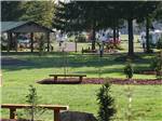 A view of a row of grassy RV sites at TOUTLE RIVER RV RESORT - thumbnail