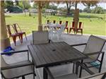 A seating area under the pavilion at KOC KAMPGROUND - thumbnail