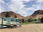 A motorhome in a gravel RV site at CHALLIS GOLF COURSE RV PARK - thumbnail