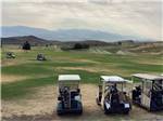 A row of golf carts at the golf course at CHALLIS GOLF COURSE RV PARK - thumbnail