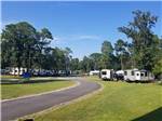 A paved road leading to the RV sites at SOUTHERN RETREAT RV PARK - thumbnail