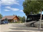 The main building with a motorhome at TWIN PINES RV PARK & CAMPGROUND - thumbnail