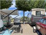 A couple of RVs with a picnic bench at TWIN PINES RV PARK & CAMPGROUND - thumbnail